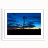 Abstract art print of Nebraska scenery in muted earth tones on a white-framed mat, ideal for dining room decor.