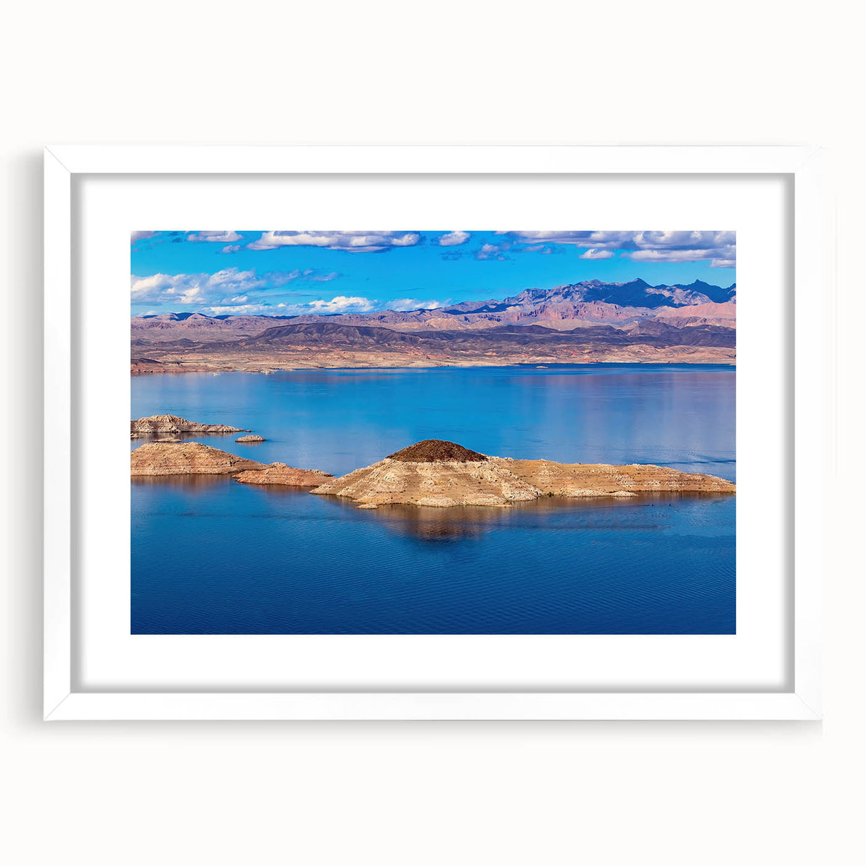 Abstract art print of Lake Mead with muted blue and gray tones on a framed white mat, ideal for dining room decor.