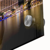 Large abstract depiction of Las Vegas skyline in muted gold and blue tones on acrylic glass, ideal for dining room art.