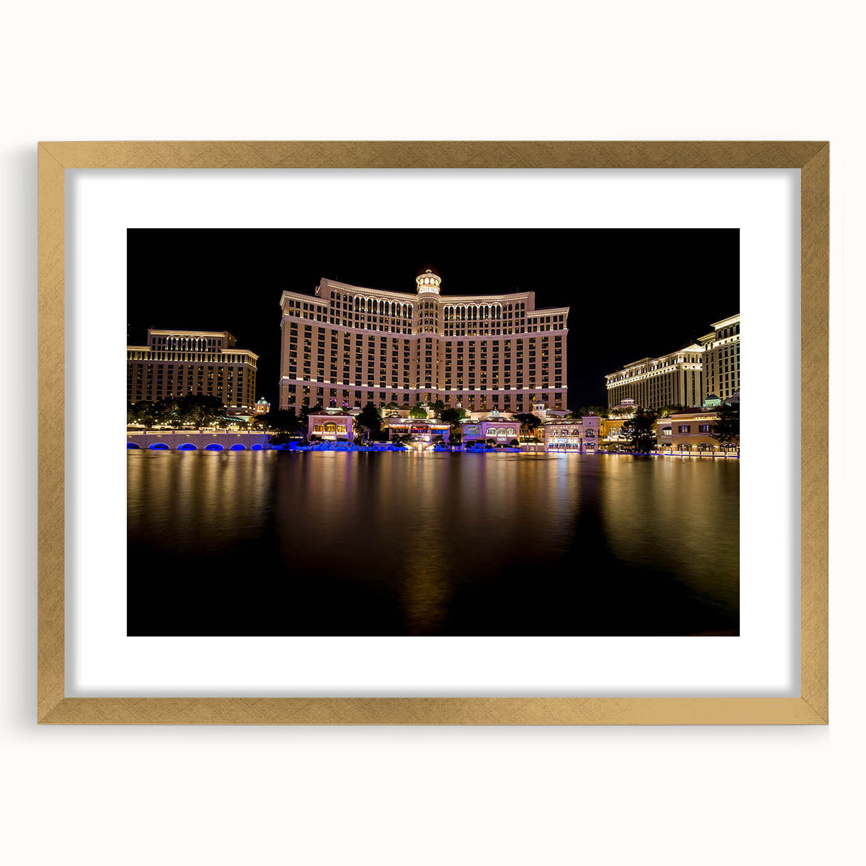 Extra large textured abstract art print of Las Vegas scene in vibrant colors on a gold-framed canvas.