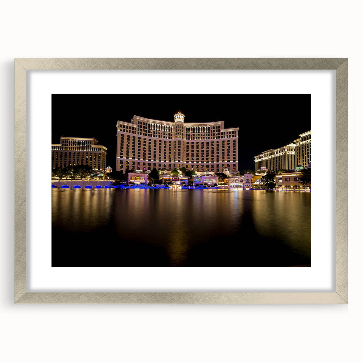 Textured abstract art print of Las Vegas skyline in silver frame, using muted gray tones, ideal for modern bedroom ambiance.