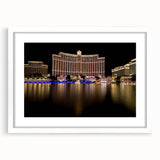 Abstract art print of Las Vegas skyline in muted grayscale on a white framed mat, suitable for dining room decor.
