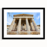 Abstract art print of Raleigh skyline in vibrant, colorful hues on a large textured canvas, ideal for living room decor.