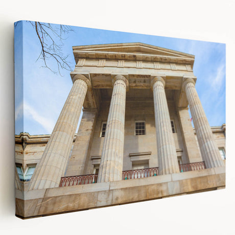 A canvas print of the Raleigh, North Carolina skyline in muted blue and gray tones, suitable for kitchen wall art.