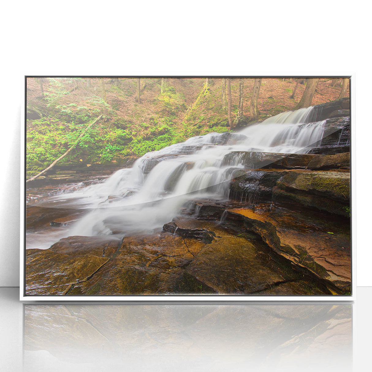 Framed acrylic print of Adirondack scenery in art deco style, with soft blue and green tones.