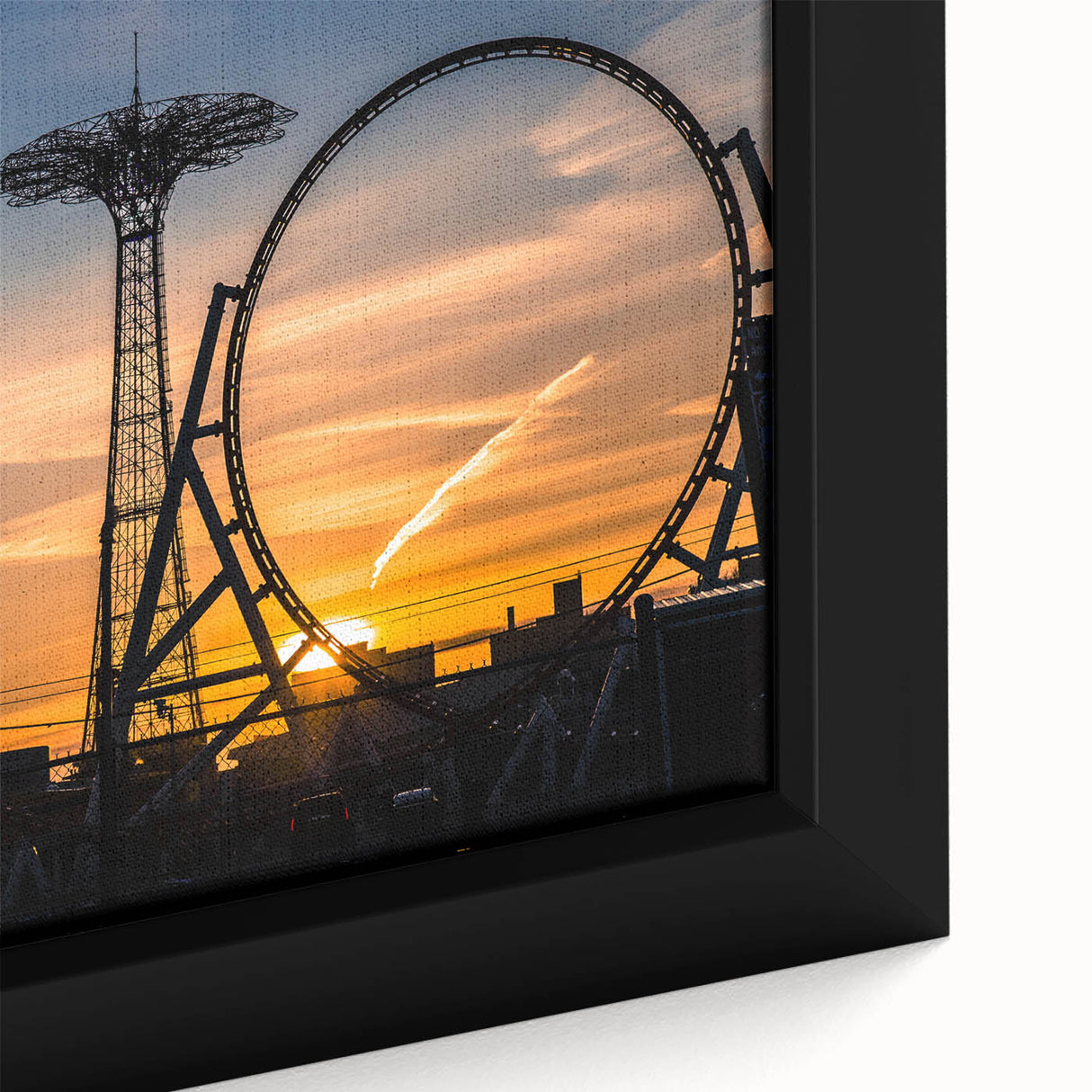 Close-up of a framed canvas featuring a textured depiction of Coney Island in black with colorful accents.