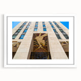Abstract art print of NYC Rockefeller scenery in muted gray tones on a white framed poster, suitable for dining room decor.