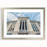 Textured abstract art print of NYC skyline in muted gray and blue tones on a framed silver mat, suitable for bedroom decor.