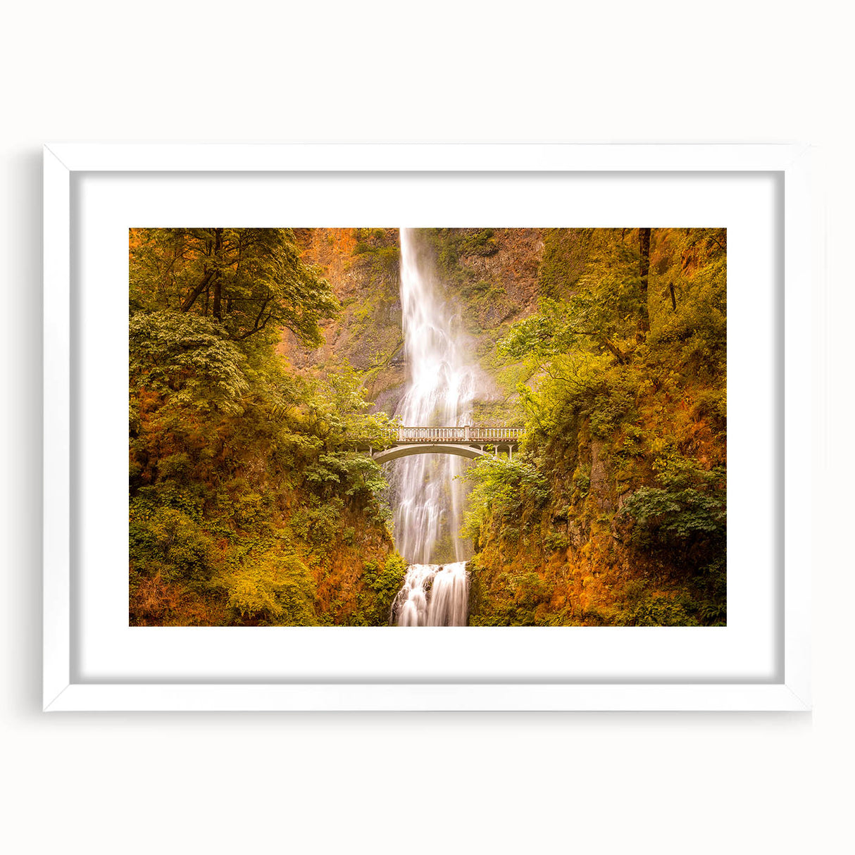 Abstract art print of Multnomah Falls in Oregon, featuring muted green and blue tones on a framed white mat.