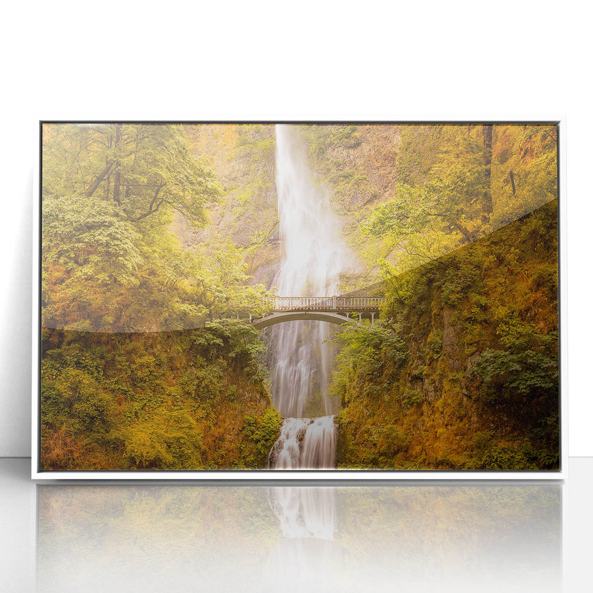 Art deco poster of Multnomah Falls in Oregon, featuring soft green and blue tones on a white framed acrylic.
