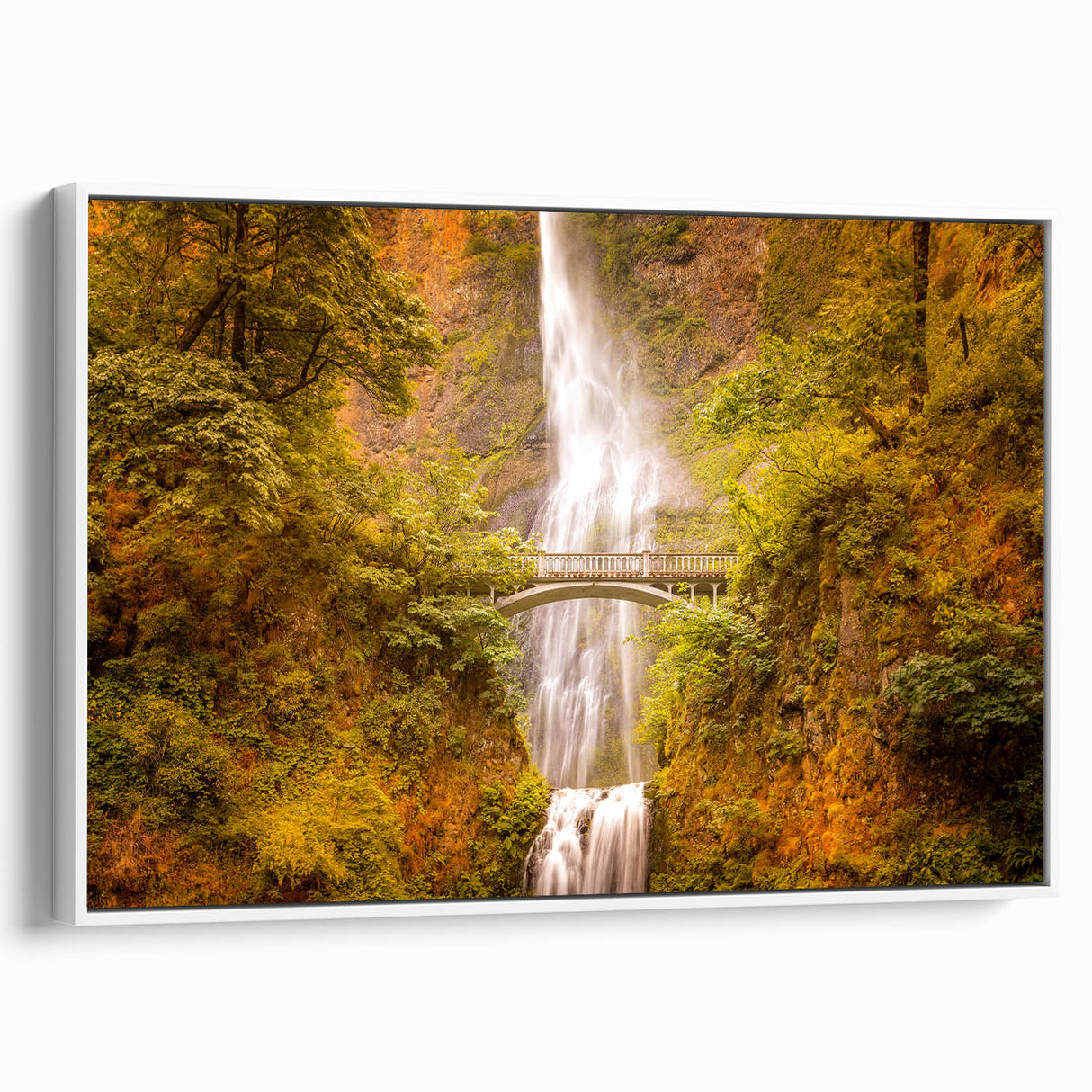 Vintage poster art of Multnomah Falls in Oregon, featuring colorful art on a framed canvas, ideal for living room decor.