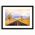 Colorful abstract art print of South Dakota Badlands in vibrant hues on a large textured canvas, framed in black.