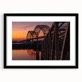 Abstract art print of Memphis landscape in vibrant colors on a large, textured canvas, framed in black.