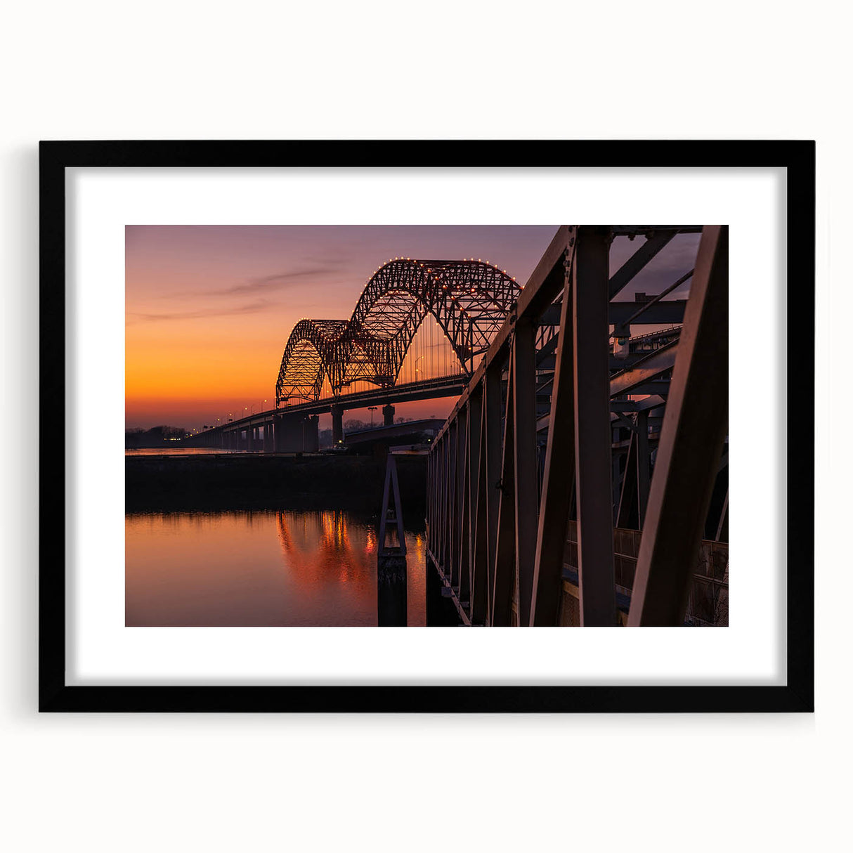 Abstract art print of Memphis landscape in vibrant colors on a large, textured canvas, framed in black.