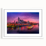 Abstract art print of Nashville skyline in muted gray and blue tones on a framed white mat, ideal for dining room decor.