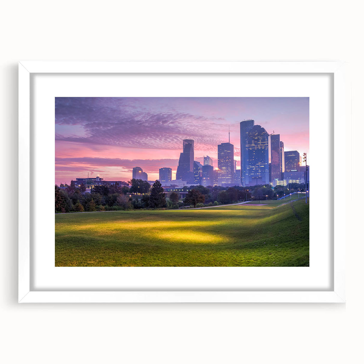Abstract art print of Houston skyline in muted gray and blue tones on a framed white mat.