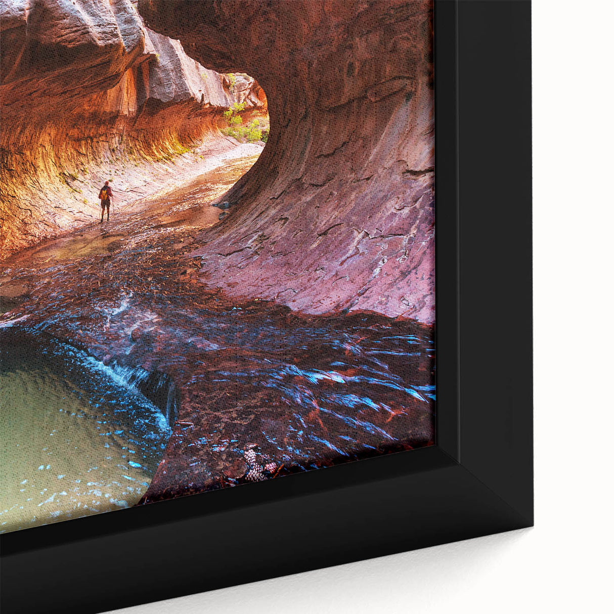Close-up of a textured black wall art depicting Zion National Park on a framed canvas, featuring vibrant, colorful art.