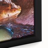 Close-up of a textured black wall art depicting Zion National Park on a framed canvas, featuring vibrant, colorful art.
