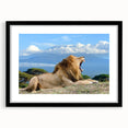 Extra large colorful art print of abstract African scenery in vibrant hues, framed with a black mat.