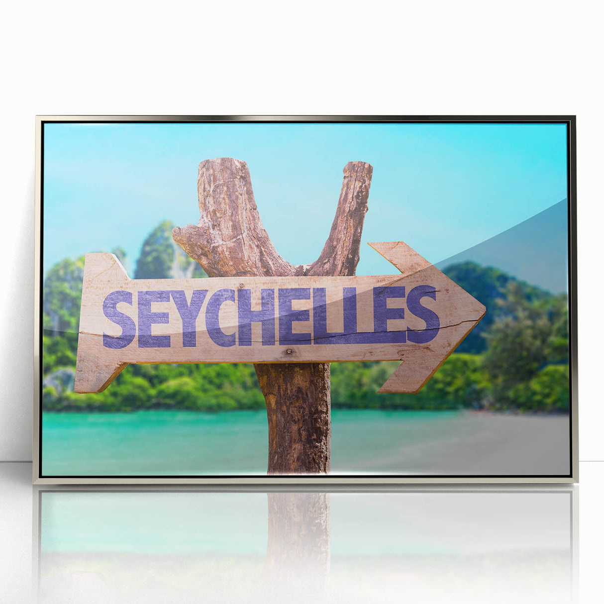 Mid-century modernist art depicting a serene Seychelles landscape in cool blue tones, framed in silver acrylic.