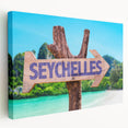 Large art print of a Seychelles beach scene in muted blue and green tones on stretched canvas, ideal for kitchen wall art.