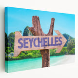 Large art print of a Seychelles beach scene in muted blue and green tones on stretched canvas, ideal for kitchen wall art.