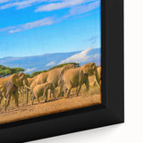 Framed canvas featuring a textured, colorful African landscape in predominantly black tones, ideal for living room decor.