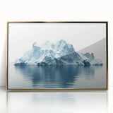 Large art print of an Antarctic landscape in muted blues and whites on a gold-framed acrylic.