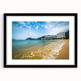Colorful abstract art print of Hong Kong skyline in vibrant hues on a large framed canvas, ideal for living room decor.