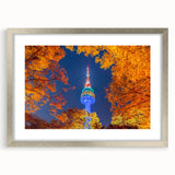 Textured art print depicting an abstract Seoul cityscape in muted gray and blue tones, framed in silver.