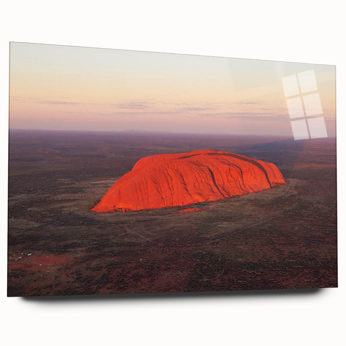Large abstract depiction of Ayers Rock in red and orange tones on acrylic glass, suitable for bedroom or dining room decor.