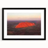 Extra large abstract art print of Ayers Rock in vibrant, colorful hues on a textured canvas, framed in black.