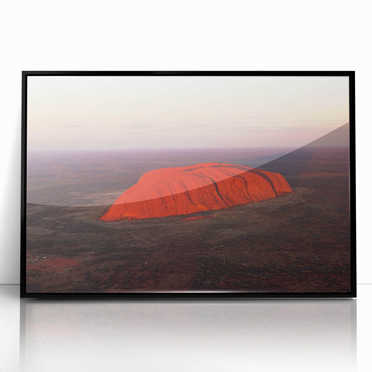 Large abstract wall art of Ayers Rock in muted earth tones on a framed acrylic, suitable for modern living room decor.