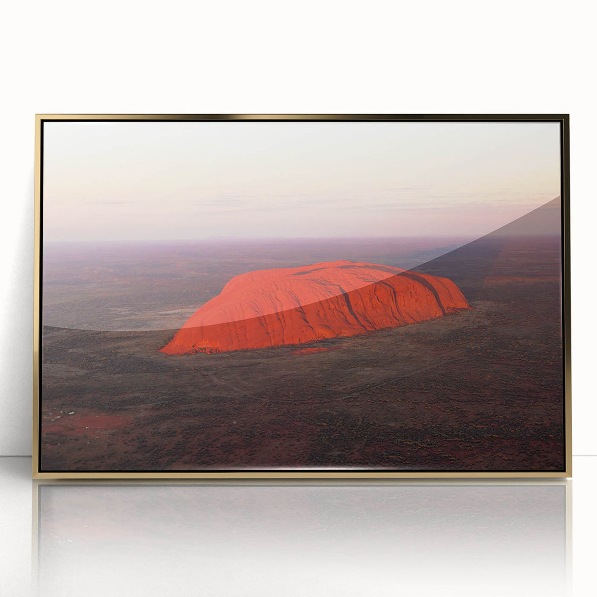 Framed acrylic print of Ayers Rock in muted earth tones, styled in mid-century modernist art, suitable for nursery wall art.