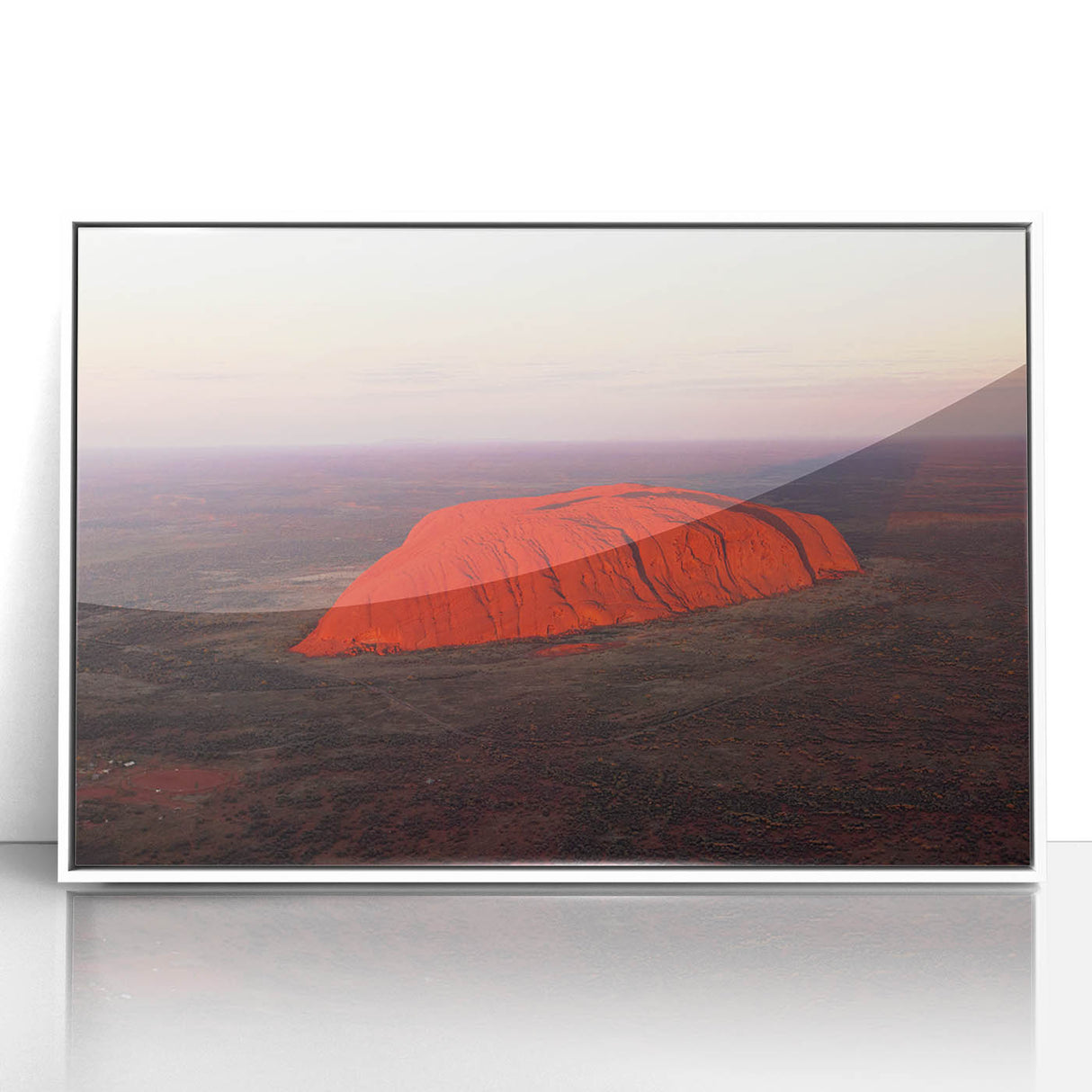 Large art print of Ayers Rock in muted earth tones, framed in white acrylic, suitable for modern art wall decor.