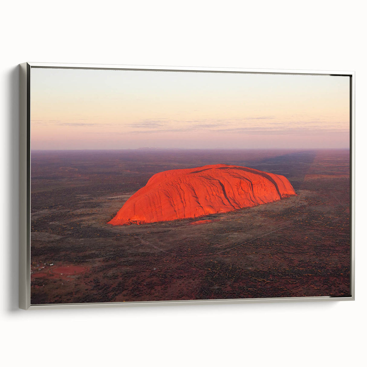 Extra large framed canvas of Ayers Rock in vintage poster style with a colorful palette, ideal for living room decor.