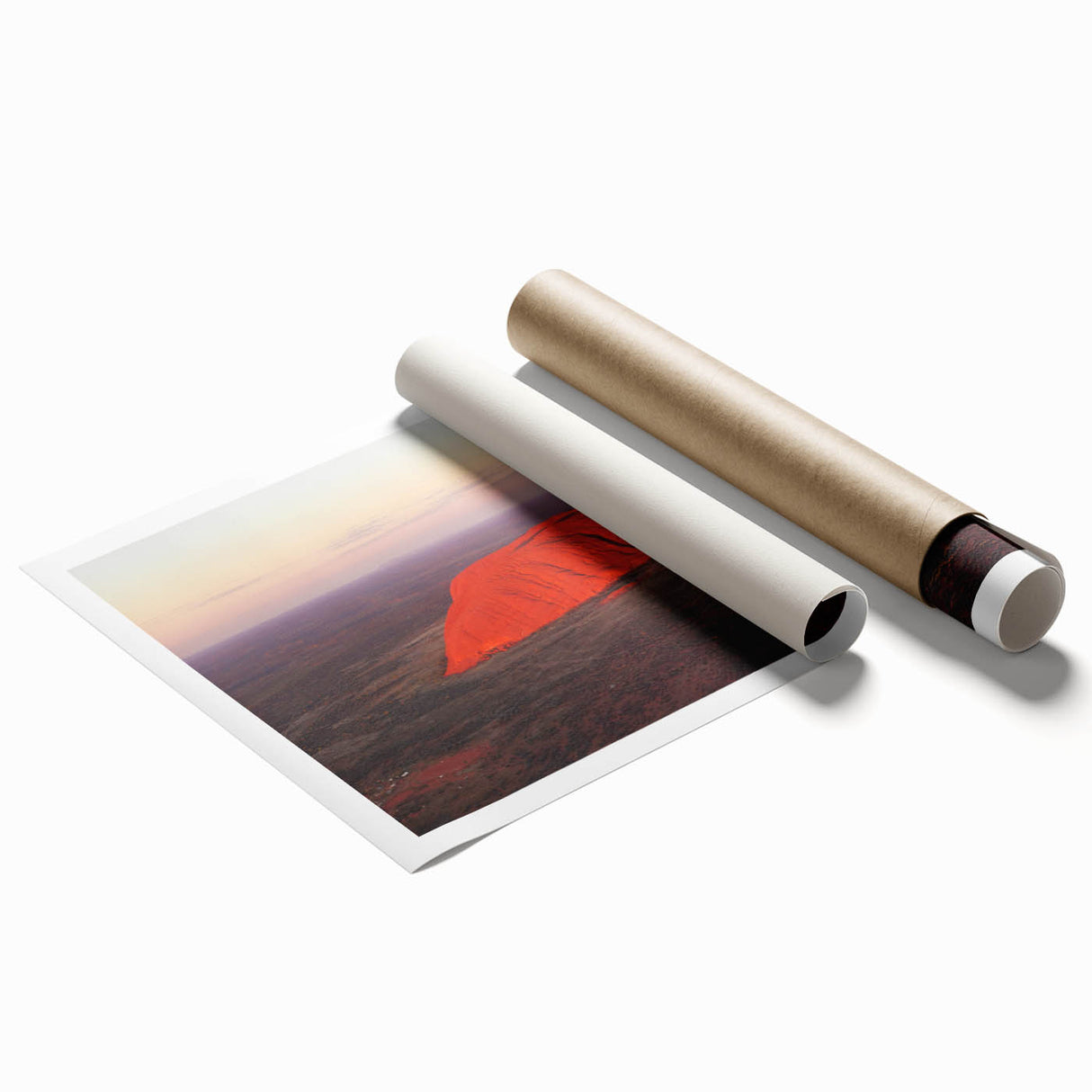 Rolled print of Ayers Rock in muted orange and brown tones, suitable for classy bathroom wall art.