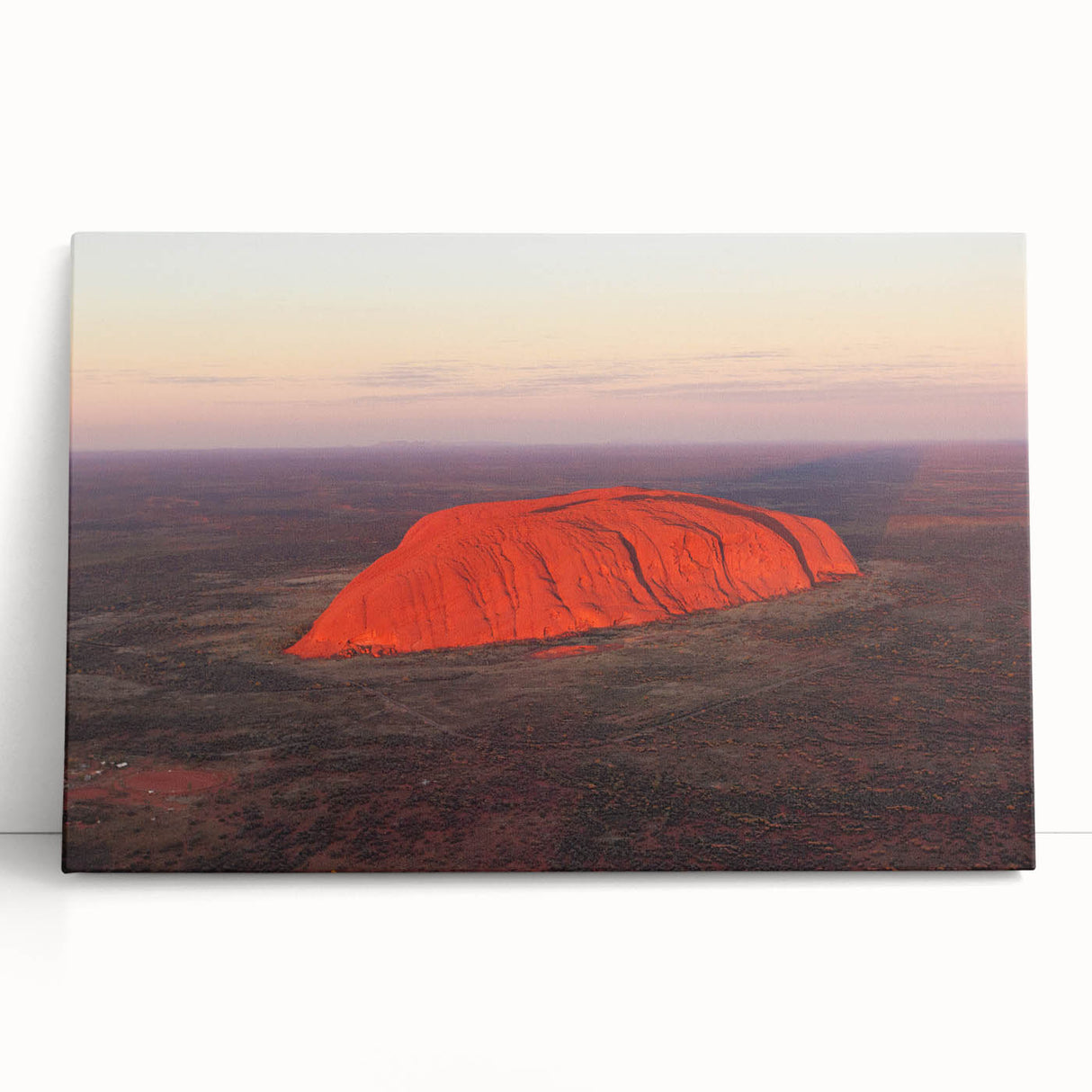 Black and white stretched canvas of Ayers Rock, ideal for kitchen wall art or bedroom decor.