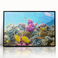 Large abstract wall art of the Great Barrier Reef in vibrant blues and greens on a framed acrylic.