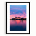 Extra large abstract art print of Sydney skyline in vibrant colors on a textured canvas, framed in black.