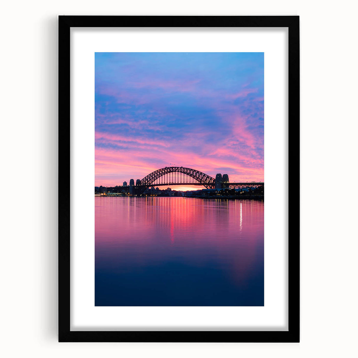 Extra large abstract art print of Sydney skyline in vibrant colors on a textured canvas, framed in black.