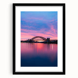 Extra large abstract art print of Sydney skyline in vibrant colors on a textured canvas, framed in black.