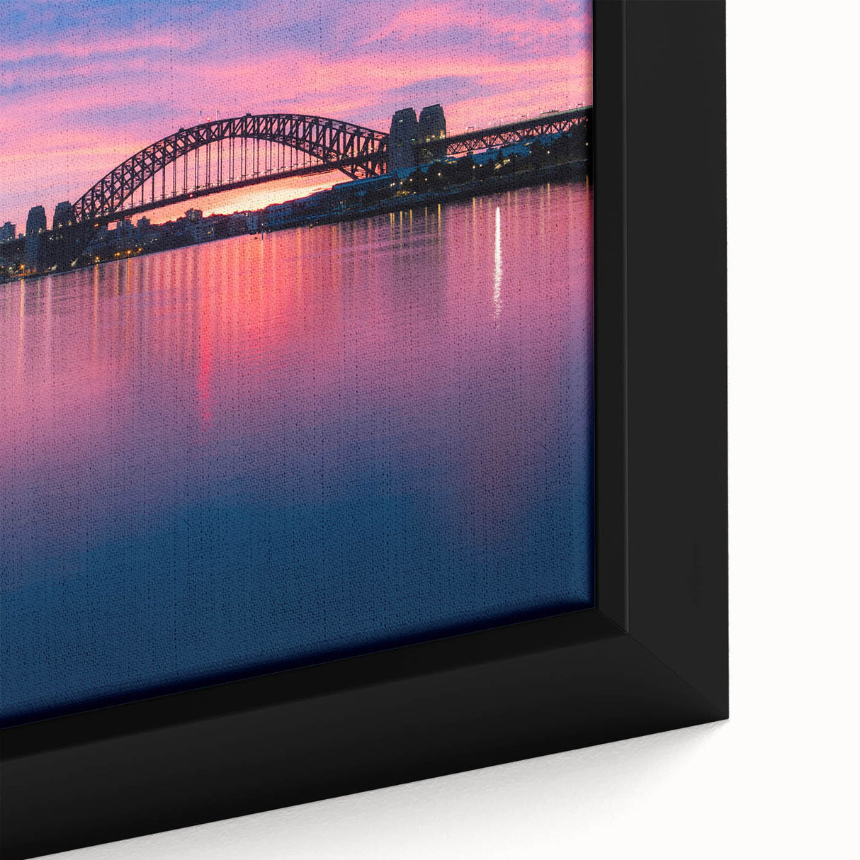 Close-up of black wall art featuring a textured Sydney skyline in vibrant colors on a framed canvas.