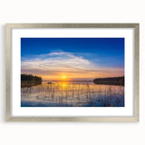 Textured art of abstract scenery in muted earth tones on a framed silver mat, ideal for bedroom decor.