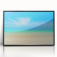 Large abstract wall art depicting a Caribbean seascape in muted blue and green tones, framed in black acrylic.