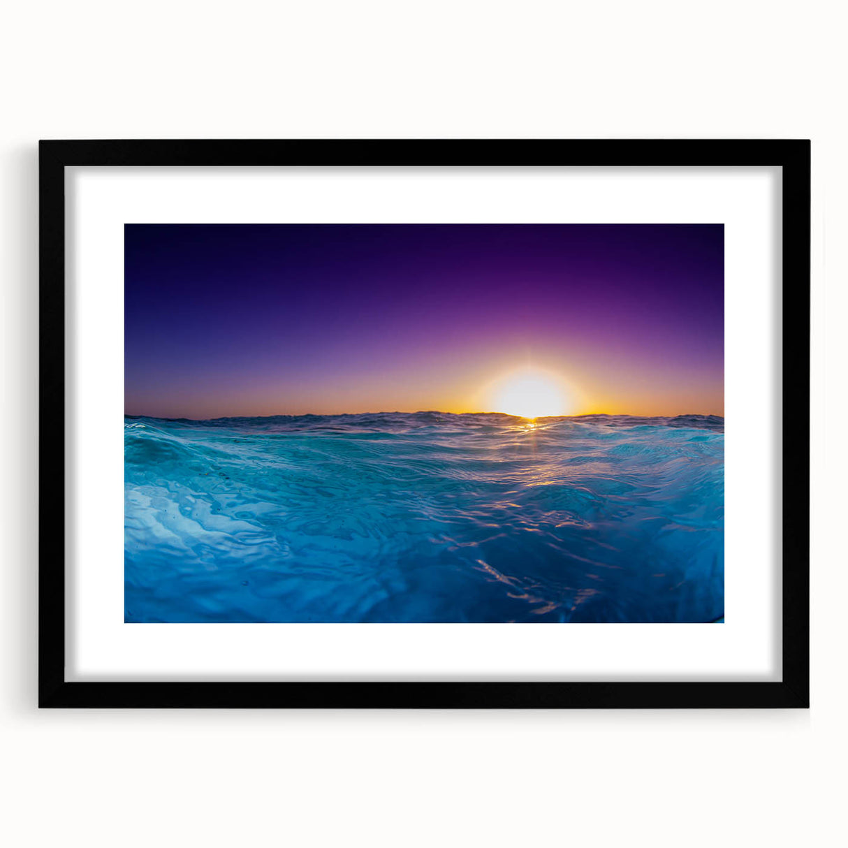 Extra large colorful art print featuring abstract Caribbean scenery in vibrant blues and greens, framed in black.