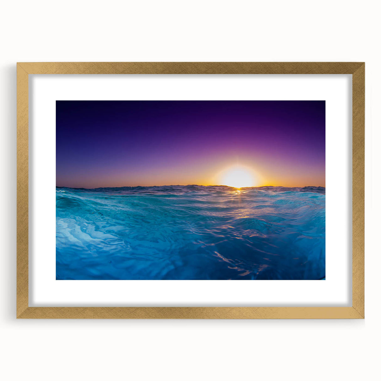 Abstract art print of a Caribbean scenery in muted blue and green tones, framed in gold, ideal for dining room decor.
