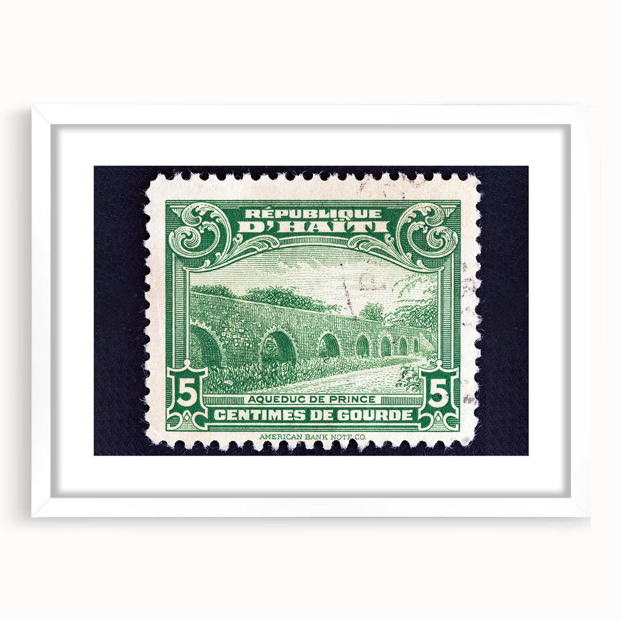 Textured abstract art print of a Caribbean scenery in muted blue and green shades, framed with a white mat.