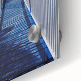 Large abstract wall art depicting the Caribbean scenery in muted blue and green on acrylic glass.