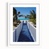 Textured abstract art print of Caribbean scenery in muted blues and greens, framed with a white mat, ideal for bedroom art.